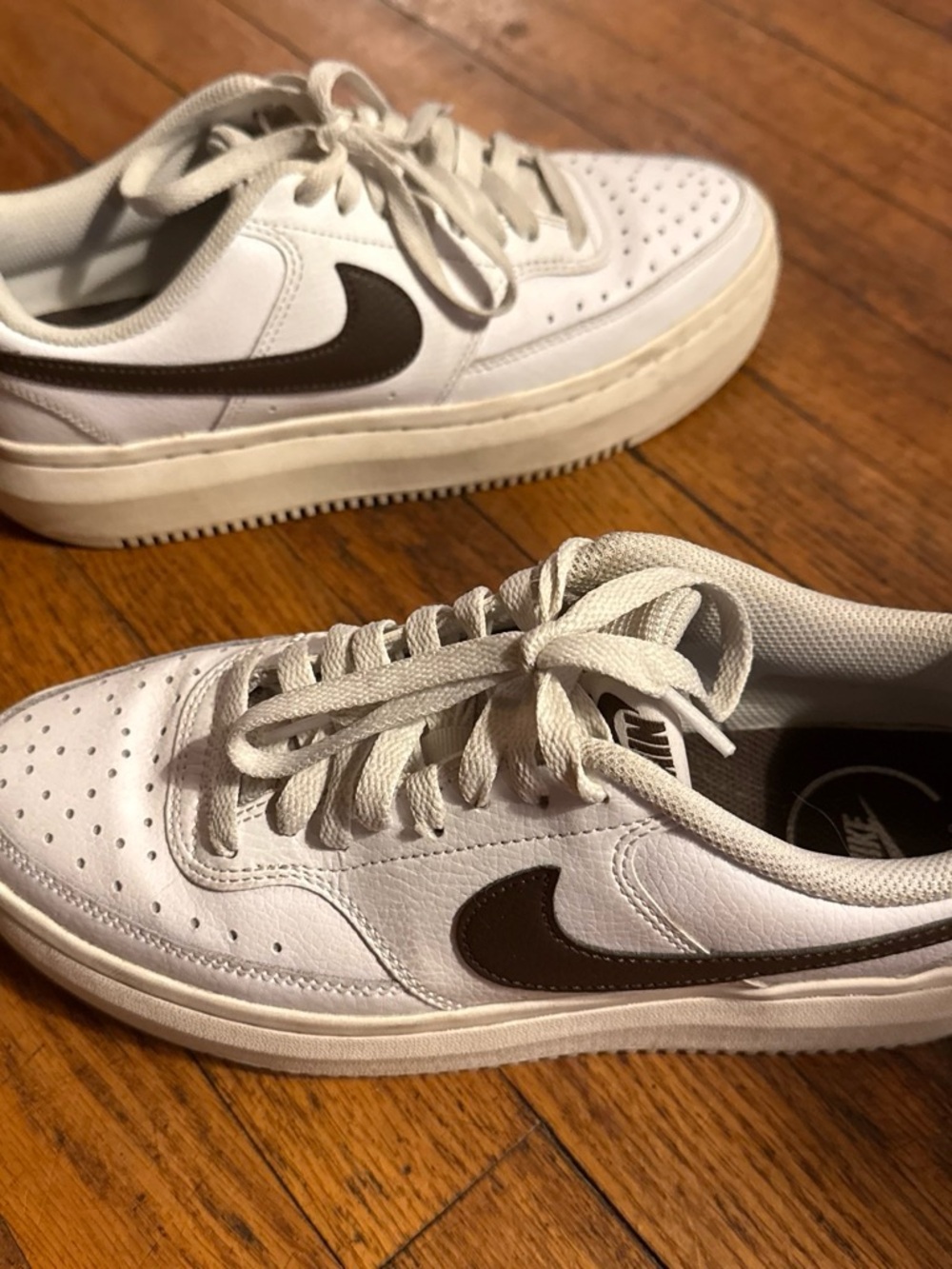 Nike Women’s White Sneakers with Brown Swoosh